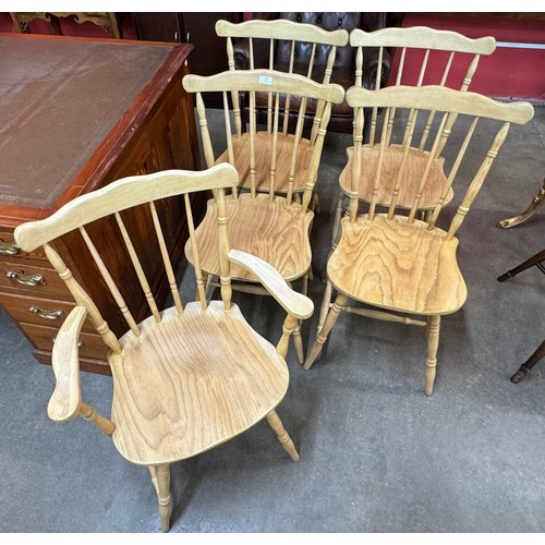 166 - A set of five spindle back kitchen chairs