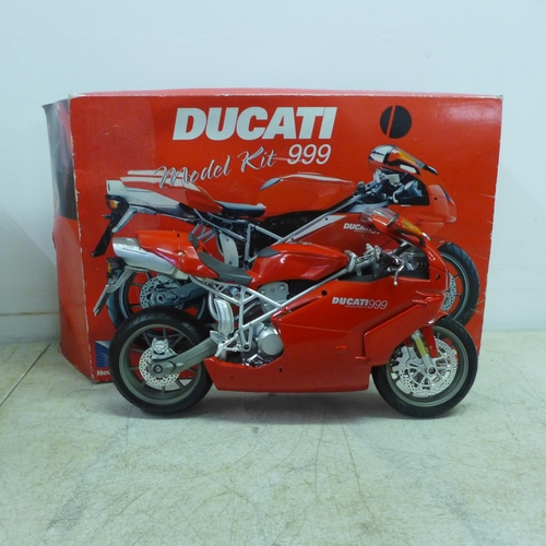 2053A - A collection of toy motorbikes - many in boxes, a remote control Harley Davidson and 1:6 scale Ducat... 