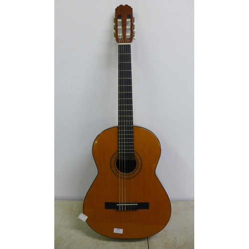 2063 - An Admira Almeria classic Spanish style acoustic guitar with back pack carry bag, foot rest and a re... 