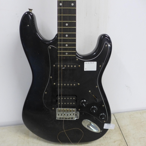2065 - A Falcon Sunburst six string electric guitar and a Vantage black gloss six string electric guitar (s... 