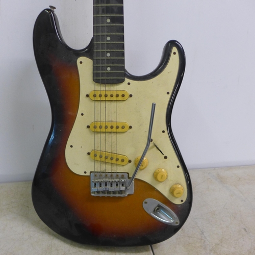 2065 - A Falcon Sunburst six string electric guitar and a Vantage black gloss six string electric guitar (s... 