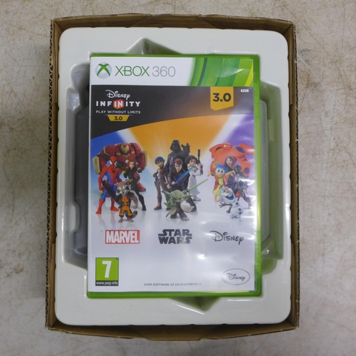 2079 - An Xbox 360 E console with controller, power supply and other cables, a Disney Infinity game board w... 