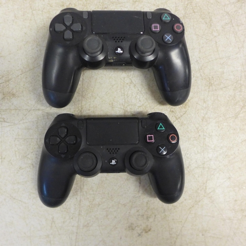 2080 - Two wireless PlayStation 4 controllers and a copy of PlayStation 4 Lego dimensions