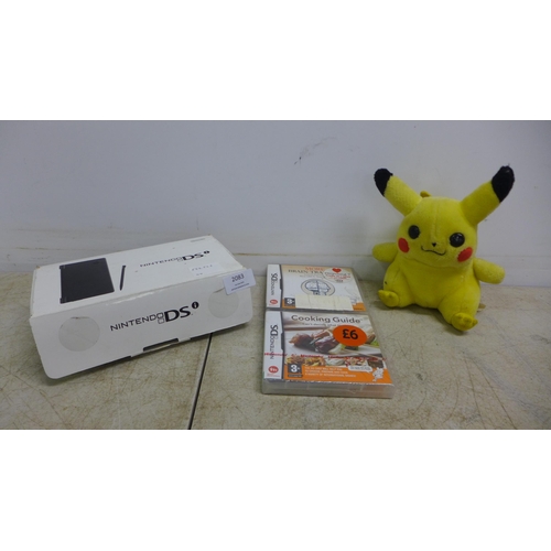 2083 - A boxed matte black Nintendo DSi with charger and two games including Cooking Guide and More Brain T... 