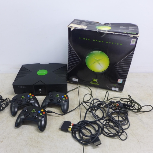 2084 - A boxed original XBOX console with three controllers