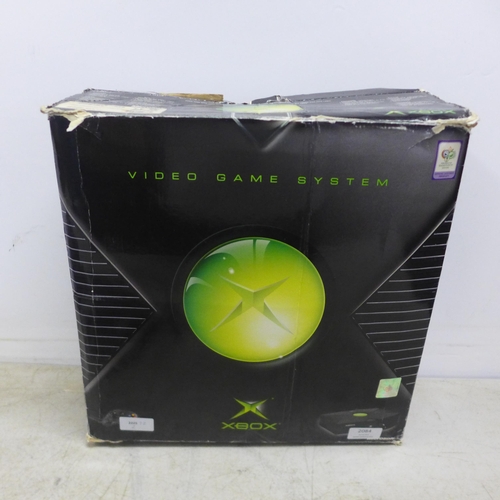 2084 - A boxed original XBOX console with three controllers