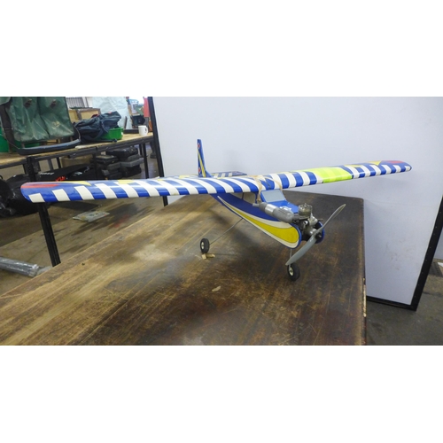 2089 - A remote-control airplane with a petrol engine, Thunder Tiger DC-12v HI-TORK starter motor, assorted... 