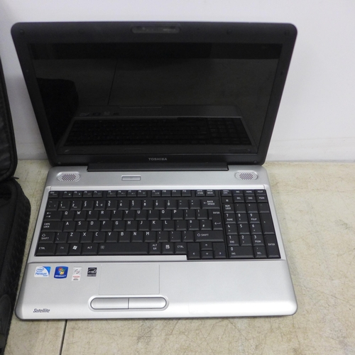 2090 - A Toshiba Satellite Windows 7 laptop (L500-IWG) with charger and carry bag - no battery