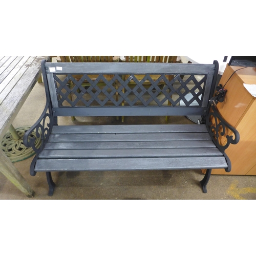 2157 - A 125cm wooden garden bench with cast iron bench ends