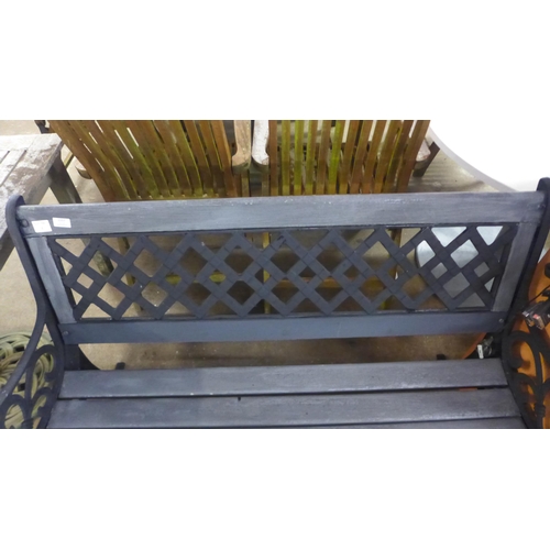 2157 - A 125cm wooden garden bench with cast iron bench ends