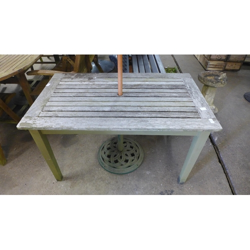 2158 - A 110cm x 72cm wooden garden table with parasol and a 150cm wooden garden bench