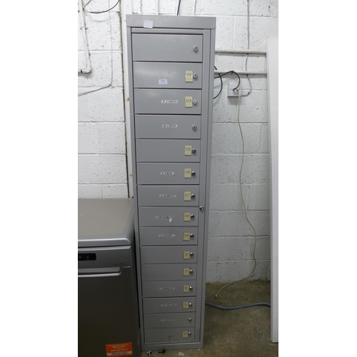 2135 - A 15 drawer lockable metal filing cabinet, with key