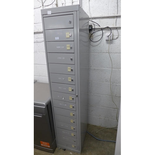 2135 - A 15 drawer lockable metal filing cabinet, with key