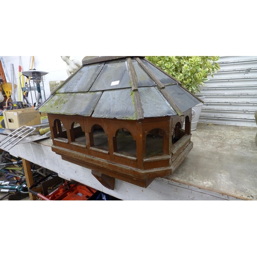 2174 - A wooden framed, slate roofed bird house without stand