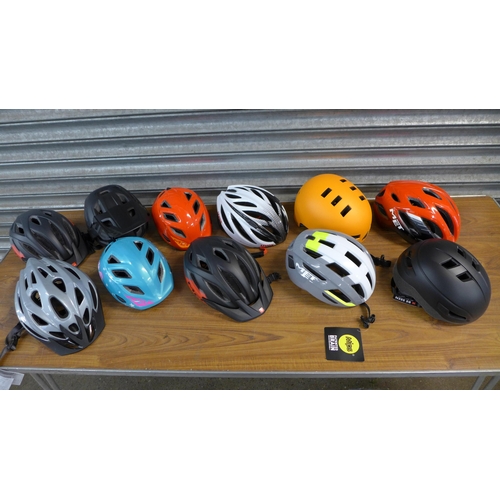 2277 - A collection of 44 Raleigh and Met cycling helmets, all sizes, as new including Uvex bike bag