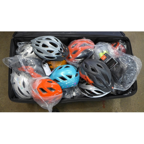 2277 - A collection of 44 Raleigh and Met cycling helmets, all sizes, as new including Uvex bike bag