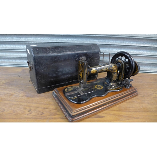 2285 - A Singer hand sewing machine, serial no. 3939856 manufacturers date 1880