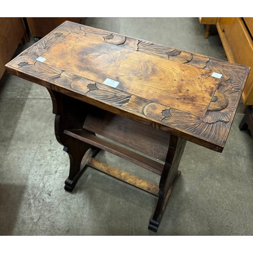 176 - A Liberty & Co. style carved beech occasional table