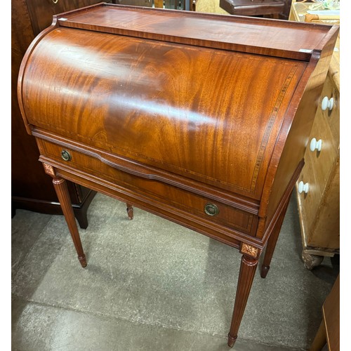 177A - A Victorian style mahogany cylinder top desk