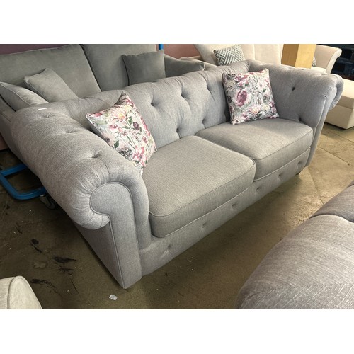 1401 - A pair of grey upholstered Chesterfield three seater sofas RRP £2798