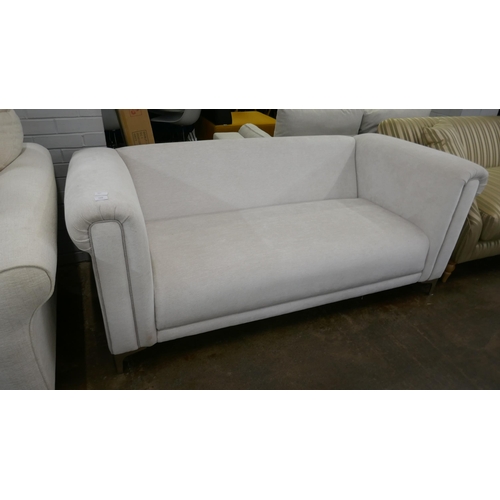 1423 - An oatmeal upholstered two seater sofa