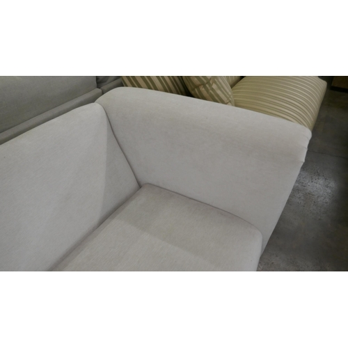 1423 - An oatmeal upholstered two seater sofa