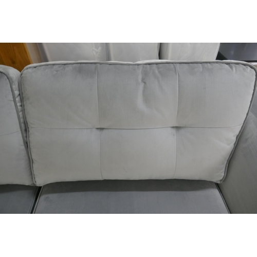 1438 - A pewter velvet three seater sofa