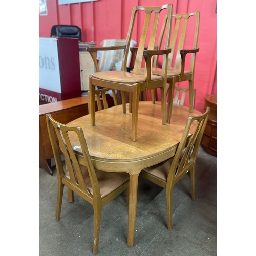 58 - A Nathan teak oval extending dining table and six chairs