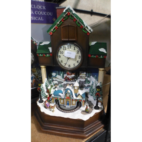 3010 - Festive Musical Cuckoo Clock and Woodchip Figure     - This lot requires a UK adaptor (327-268,286 )... 