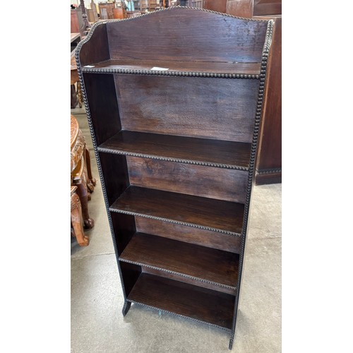 187 - An early 20th Century oak open bookcase