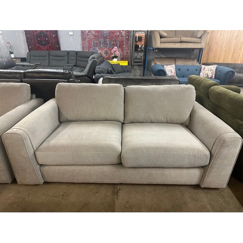 1357 - A pair of grey fabric three seater sofas