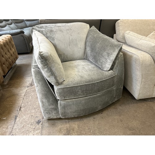 1413 - A grey velvet swivel armchair