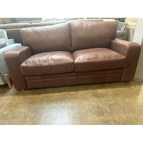 1444 - A Brown upholstered three seater sofa