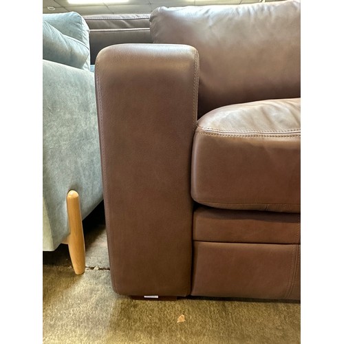 1444 - A Brown upholstered three seater sofa