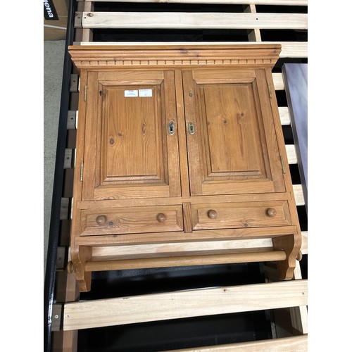 1546 - A pine bathroom/kitchen cabinet with towel rail