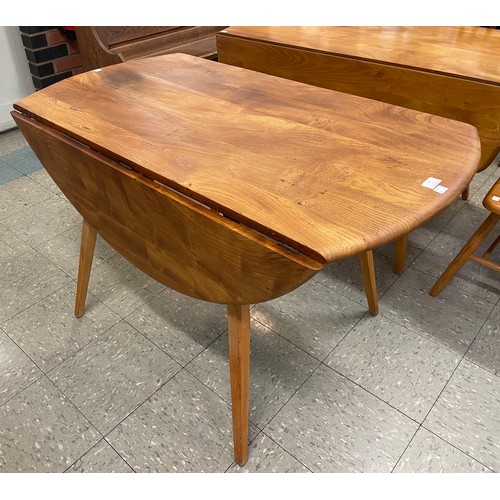 74 - An Ercol elm and beech Windsor drop-leaf table