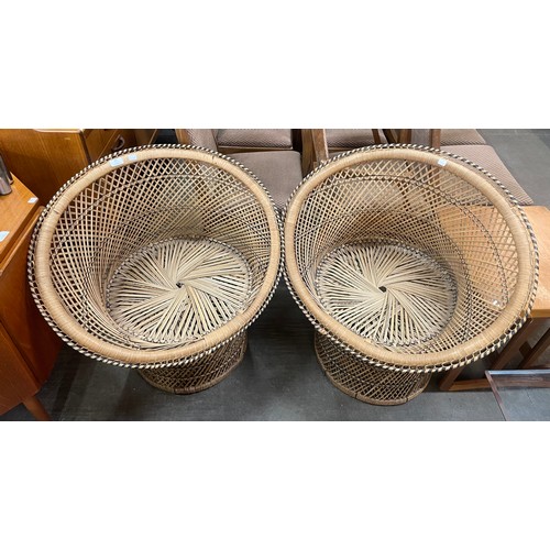 90 - A pair of wicker peacock chairs