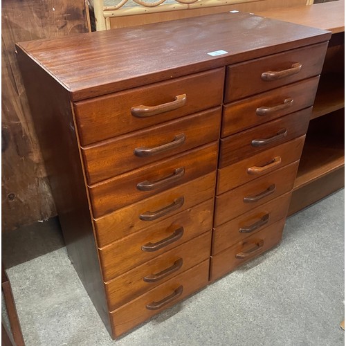 94 - A teak fourteen drawer haberdashery chest