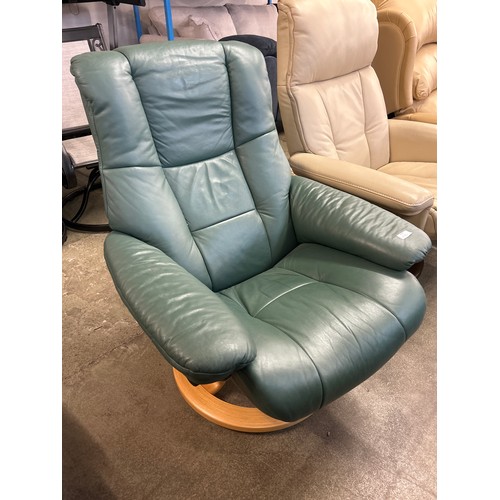 1490 - A green upholstered reclining swivel armchair