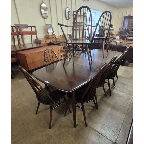 135 - An Ercol Golden dark elm and beech Grand Windsor dining table and ten Quaker chairs