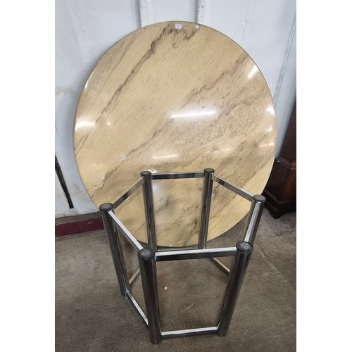 131 - A chrome hexagonal based dining table, with circular marble top