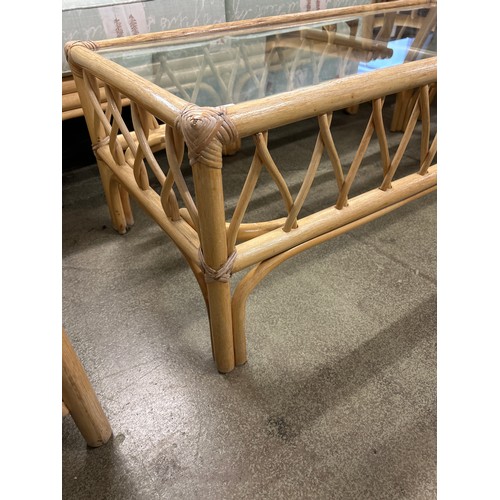 1518 - A cane glass topped coffee table