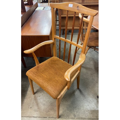 103 - A Danish style yew wood elbow chair