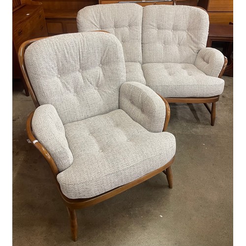 123 - An Ercol Golden Dawn beech Jubilee settee and armchair