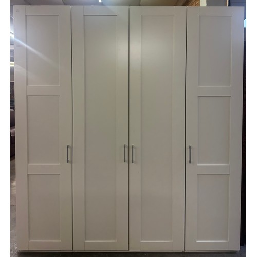 1441 - A white four door wardrobe * this lot is subject to VAT