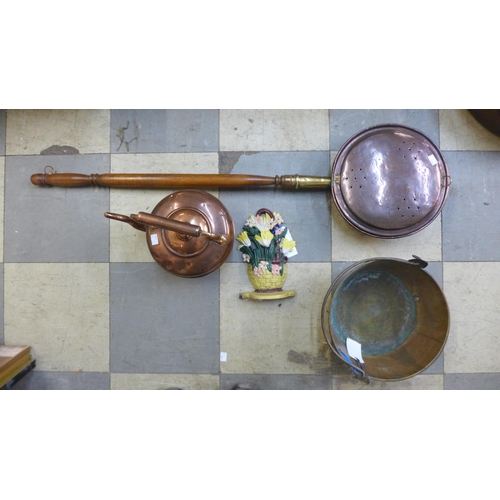 416 - A Victorian copper kettle, brass jam pan, cast iron door stop and a warming pan