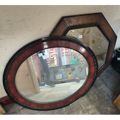 421 - An oak octagonal framed mirror and one other