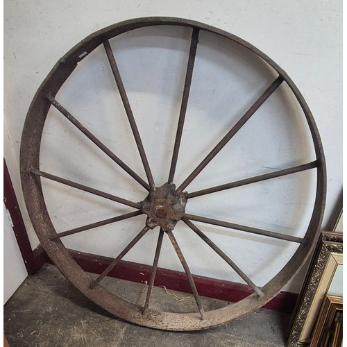 426 - A large cast iron wheel