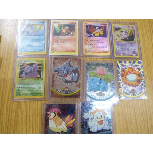 656 - Ten vintage Pokemon cards and stickers and players guides, etc.