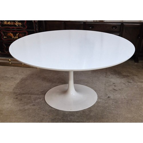 11 - An Arkana white laminate tulip shaped circular dining table, designed by Maurice Burke